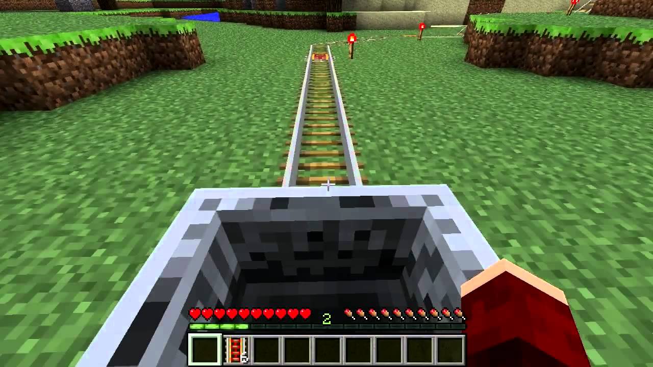 A Minecraft crafting grid with gold ingots in the left and right columns, one stick in the center slot, and redstone dust in the bottom-center slot to craft powered rails