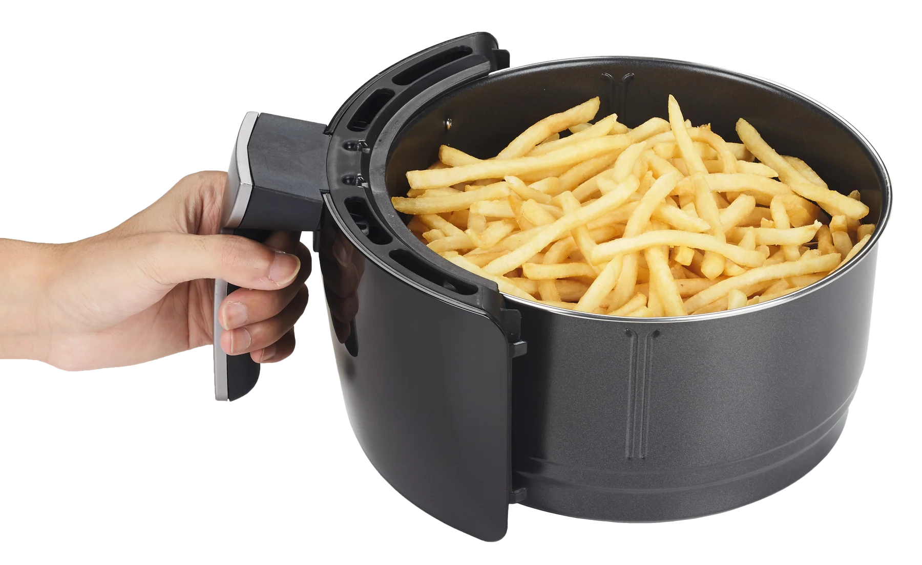 A basket of golden, crispy air fryer fries piled high with a small ramekin of ketchup on a simple wooden table