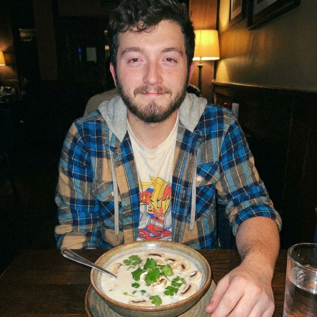 A bowl of coconut soup with mushrooms and cilantro
