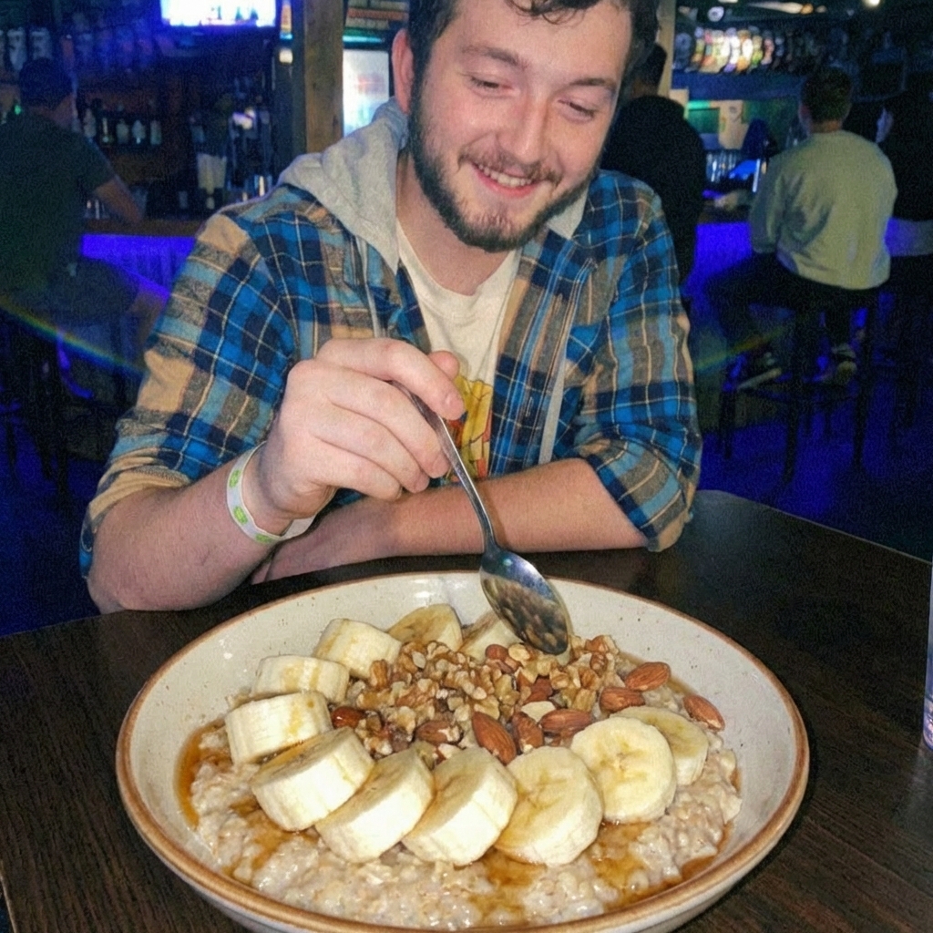 A bowl of oatmeal topped with sliced bananas and nuts