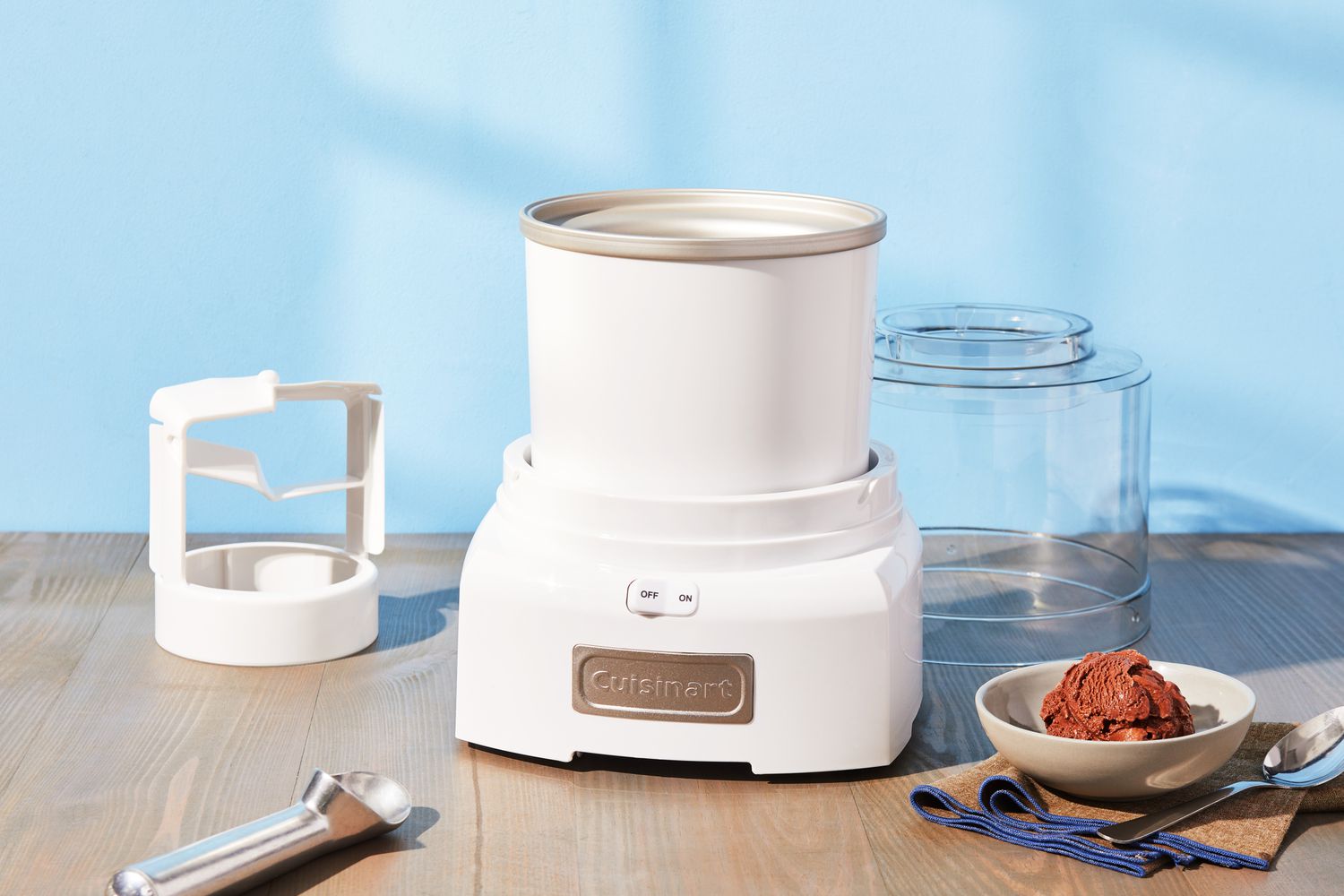 A home ice cream maker with a chilled bowl sitting on a clean kitchen counter
