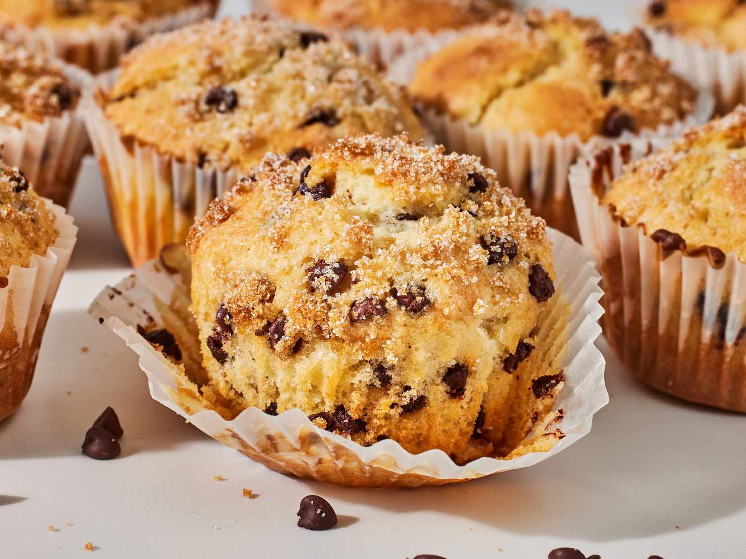 A small bowl filled with semi-sweet chocolate chunks on a kitchen counter