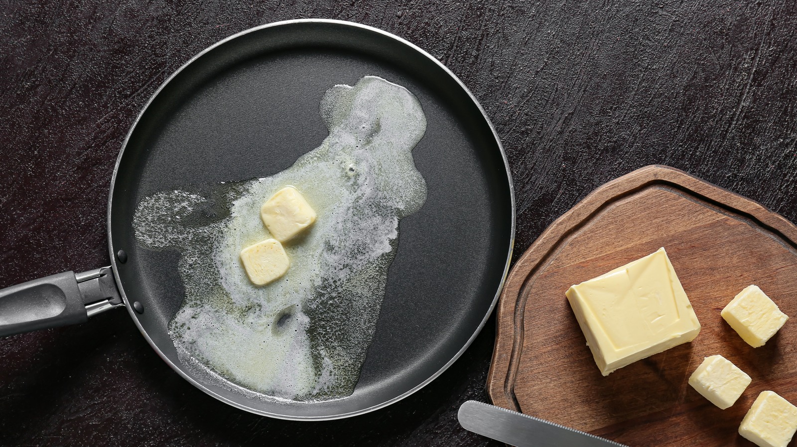 Butter melting and foaming in a hot skillet on a home stove