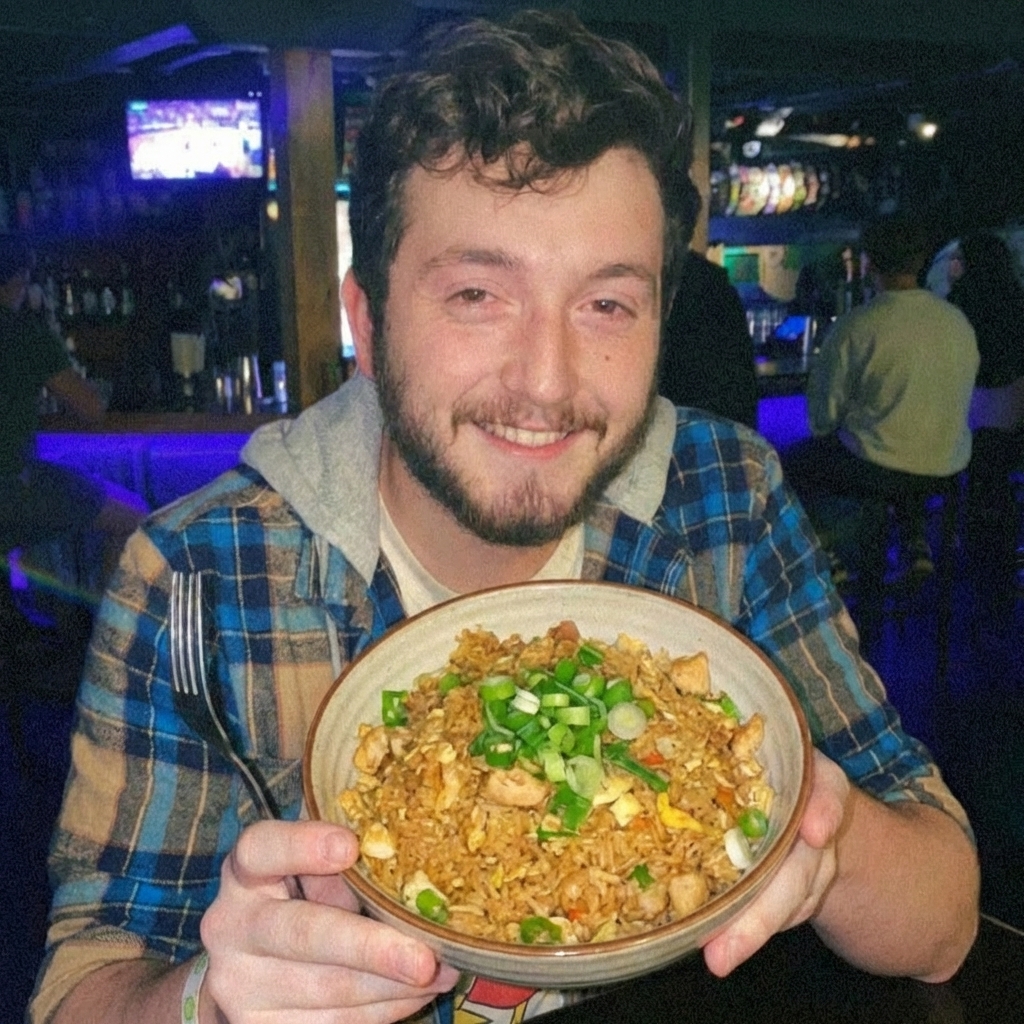 Chicken fried rice in a bowl topped with sliced green onions