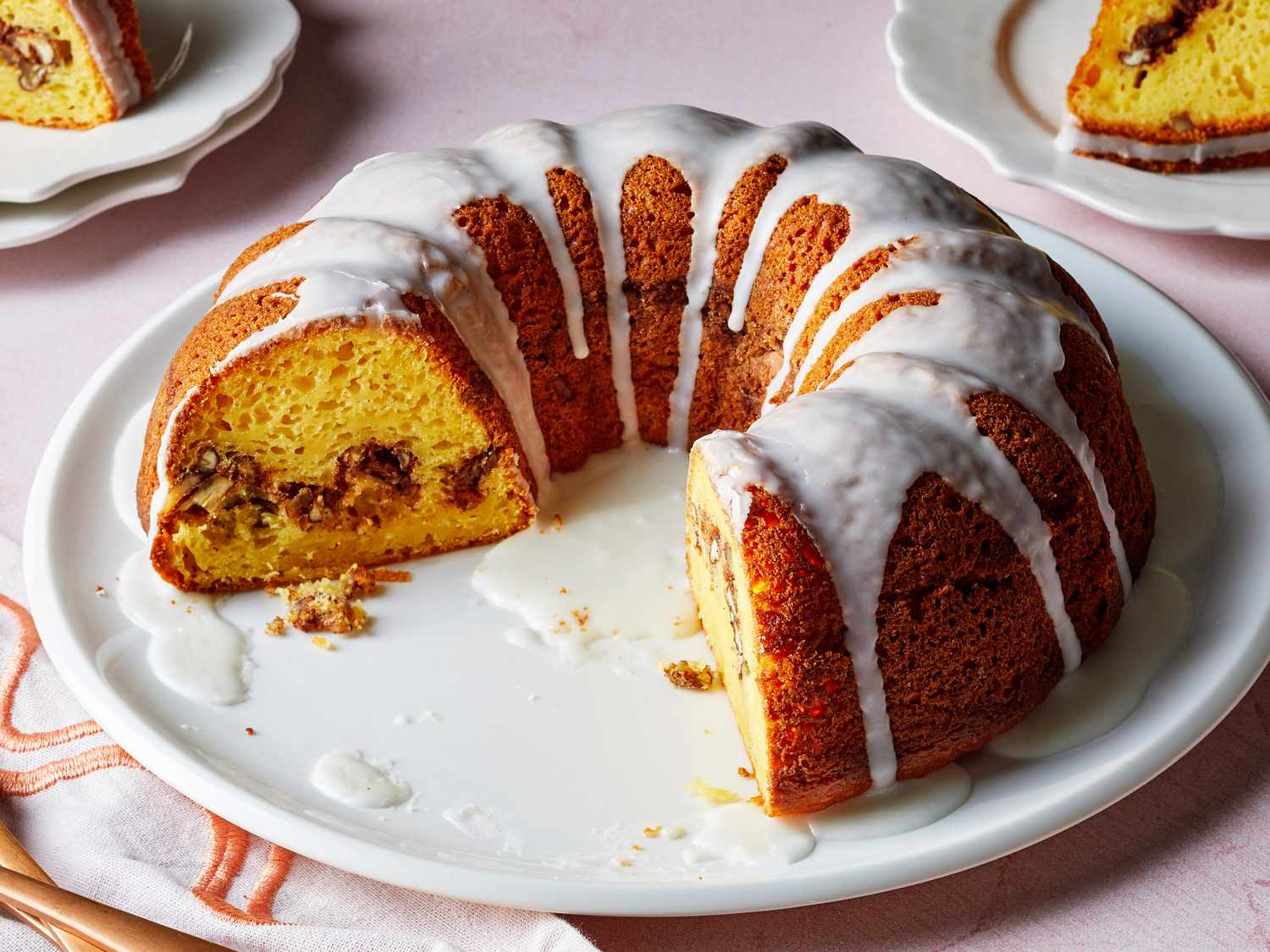 Individually wrapped slices of Bundt cake stored in a freezer-safe container on a kitchen counter