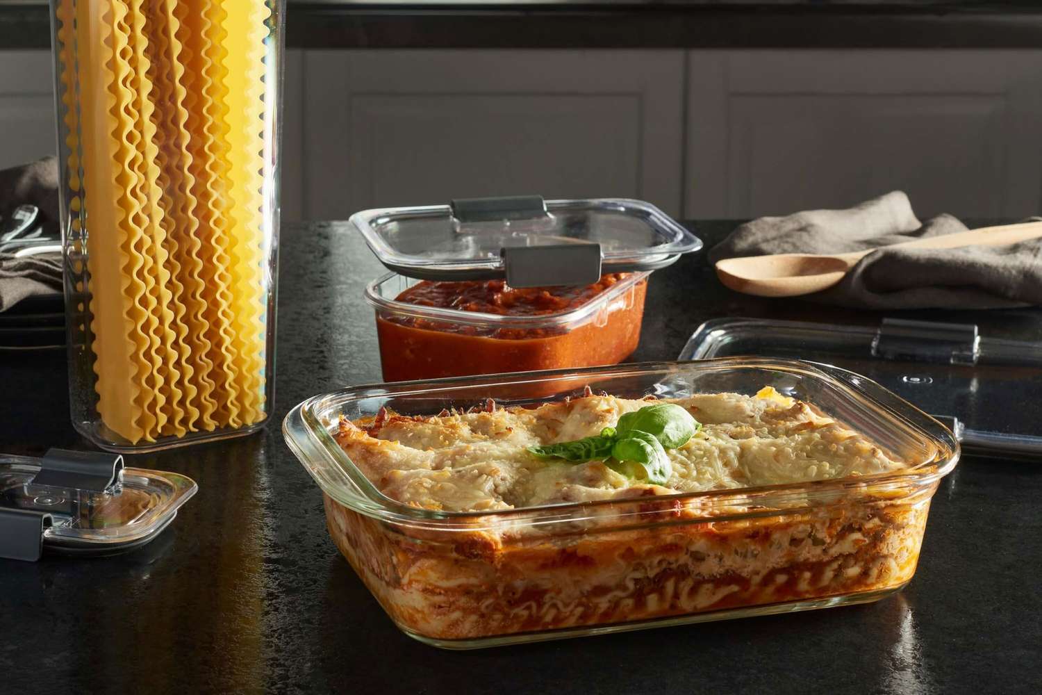 Leftover broccoli rice casserole portioned into a glass meal-prep container with a lid on a kitchen counter
