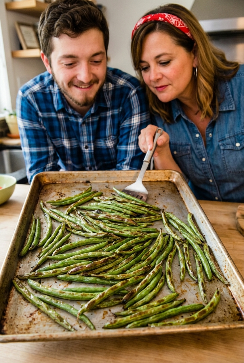Roasted green beans on a sheet pan with blistered edges