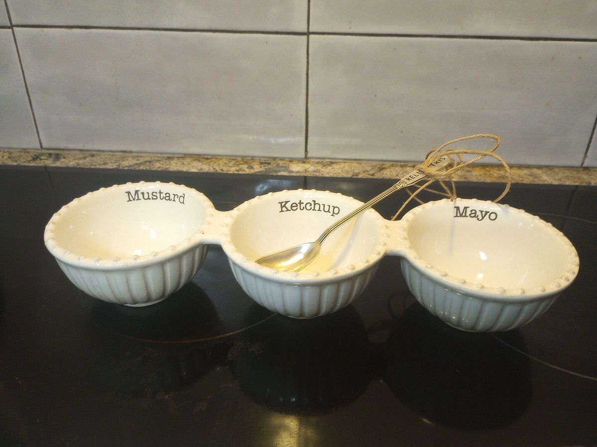Small bowls of mayonnaise, ketchup, mustard, and dill relish arranged on a kitchen counter ready for mixing